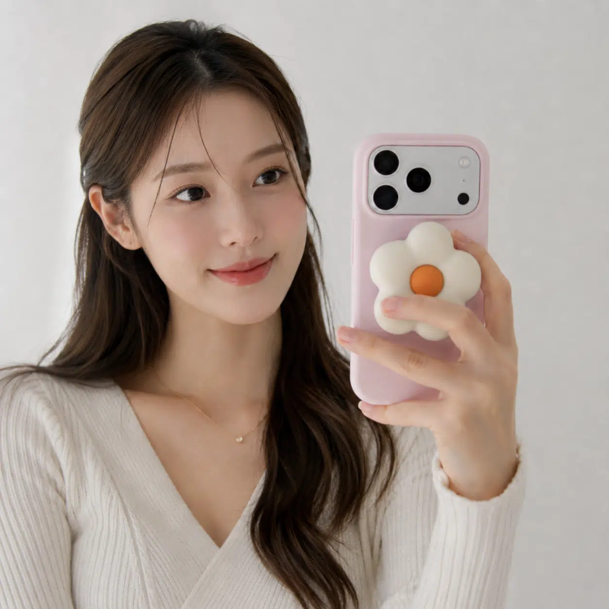 Puffy Flower Grip - Cream — in hand