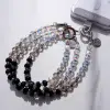 Mini Luxe (Midnight) Phone Charm — in hand