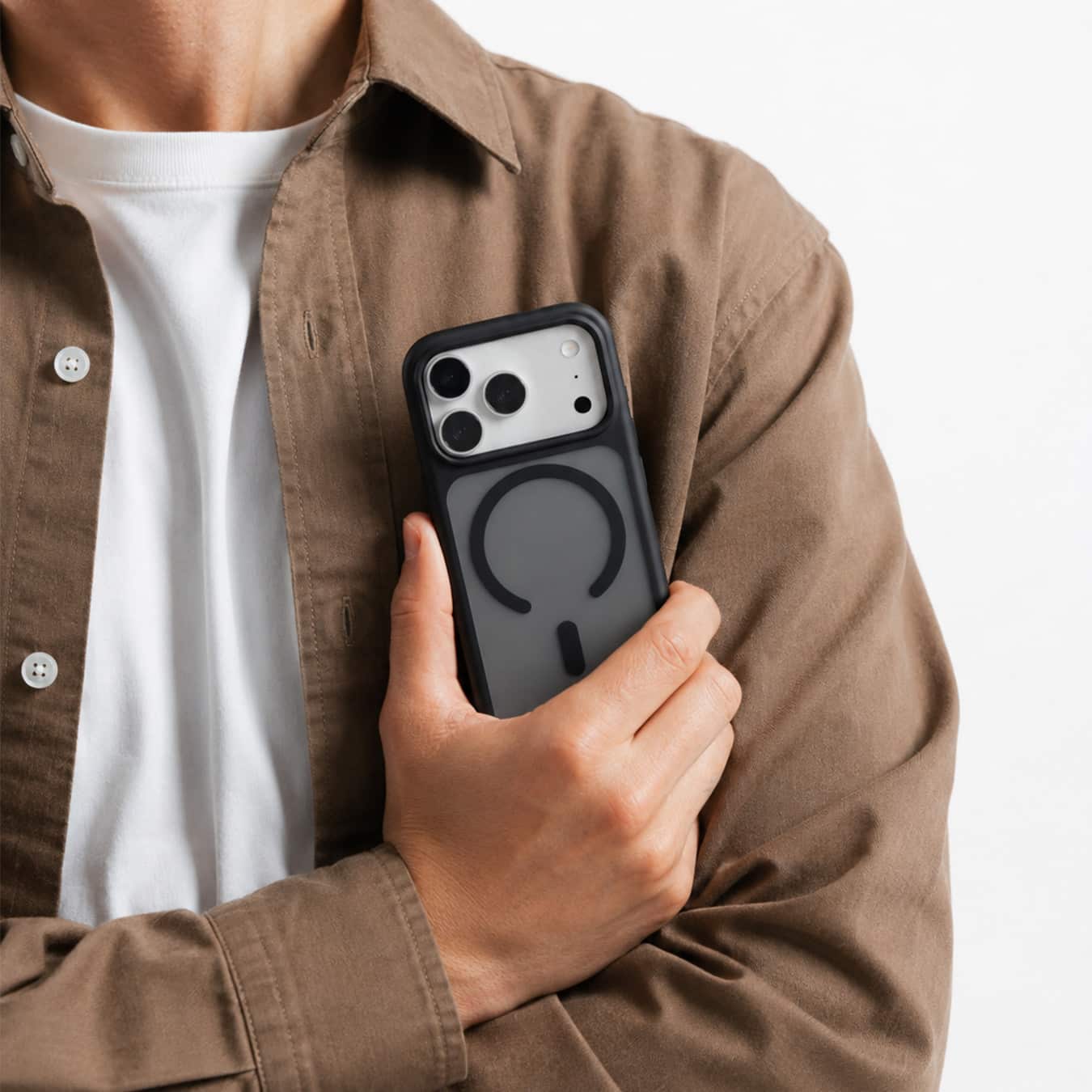Man holding an iPhone in a black GALADO Knoxx Guard matte case